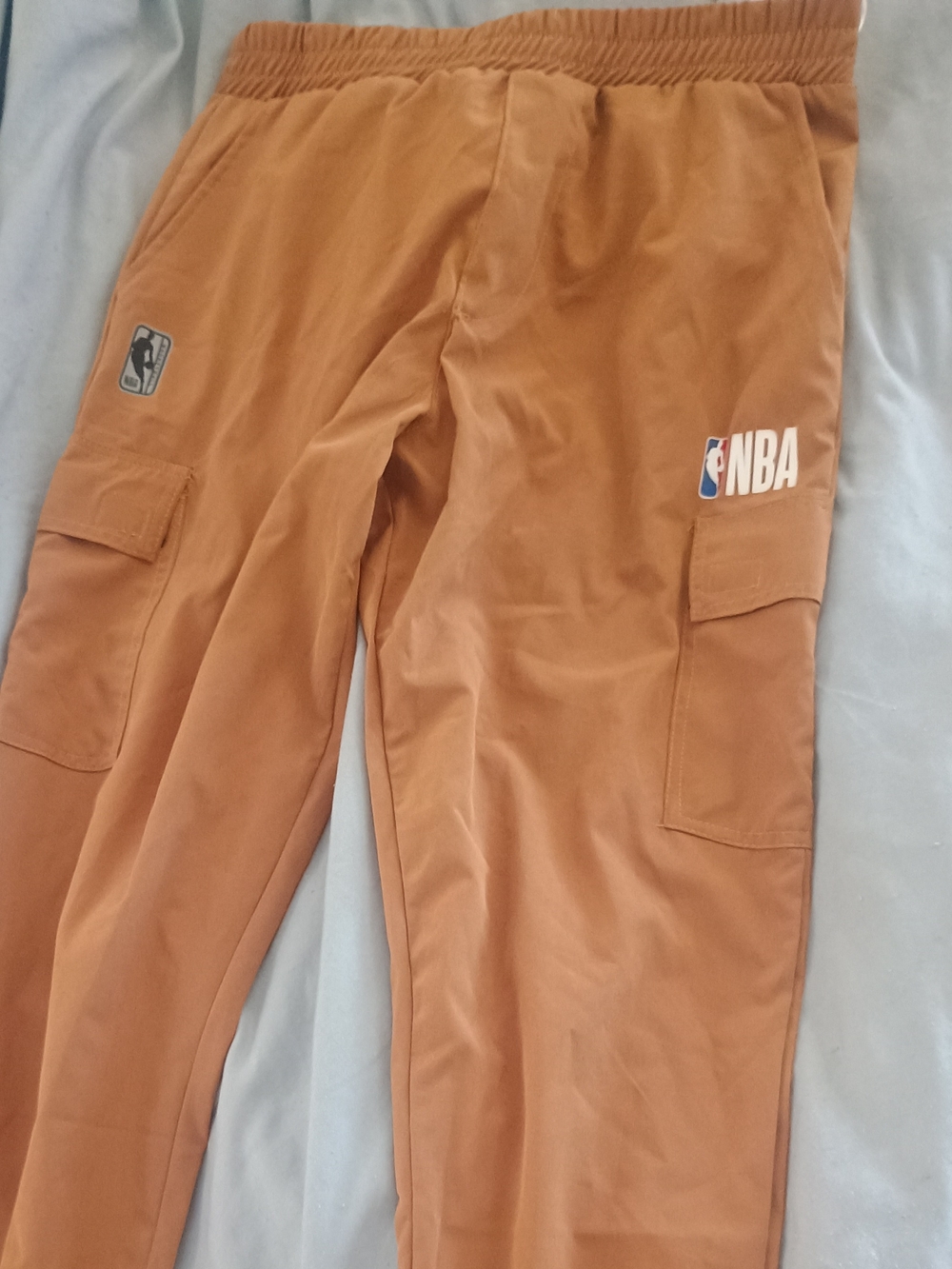 NBA Tan Youth Shorts with Blue Logo Tag